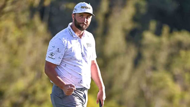 Jon Rahm fist pumps while making a putt at the 2022 Sentry Tournament of Champions in Kapalua, Maui, Hawaii.
